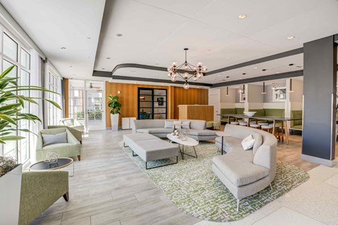 a living room with couches and chairs and a table